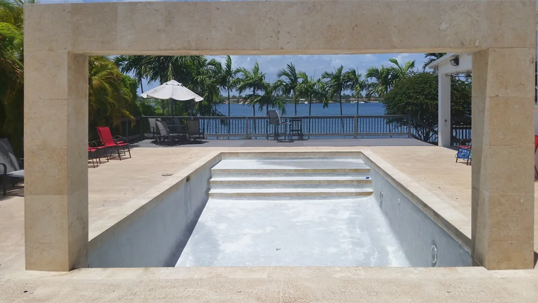 Old stained pool plaster before resurfacing in Miami FL