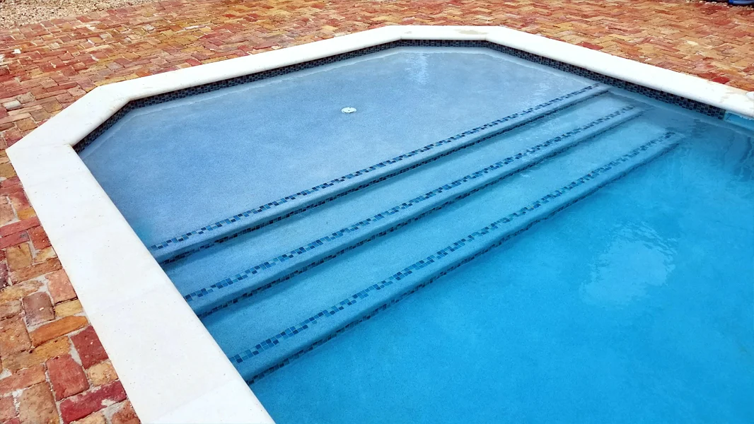 Resurfaced pool alternate view in Miami FL - Diamond Brite quartz finish