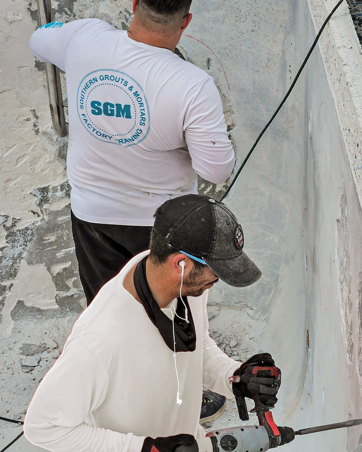 SGM factory-trained Miami pool contractor chipping out old plaster before resurfacing